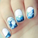 Cool and wavy summer nail art design. This rather simplistic design  combines white and blue