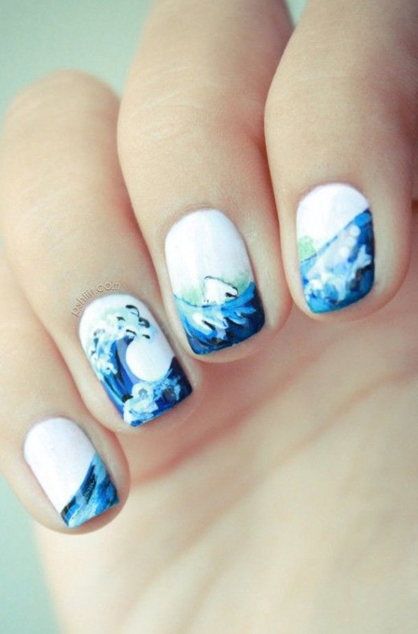 Cool and wavy summer nail art design. This rather simplistic design  combines white and blue