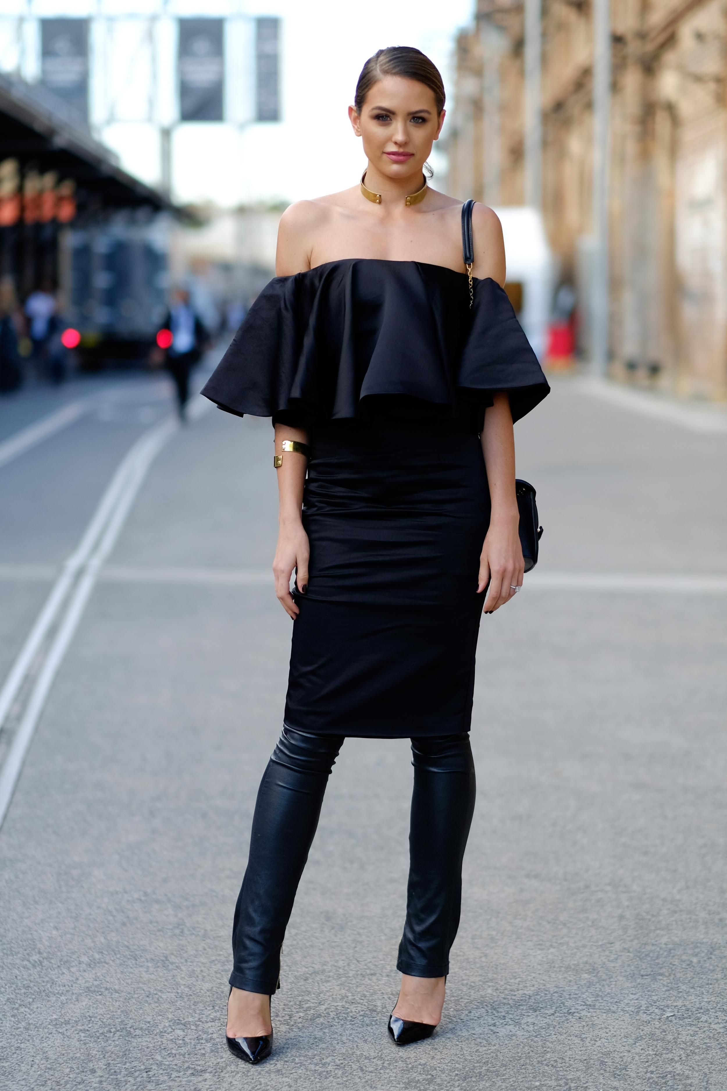 How to Layer a Skirt Over Pants or a Dress - off the shoulder feminine  ruffle dress layered over slim leather pants—gorgeous!