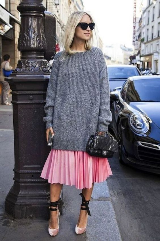 a pink pleated midi skirt, an oversized grey sweater, pink velvet shoes  with lacing