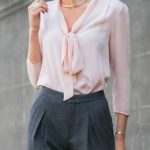blush pink tie bow neck blouse, high-waisted pleated grey wool pants