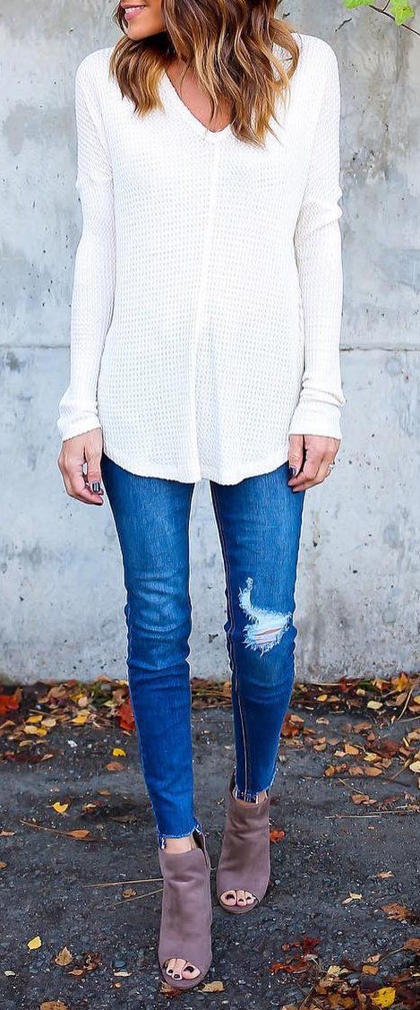 White V-neck Blouse // Ripped Skinny Jeans // Ankle Boots Source