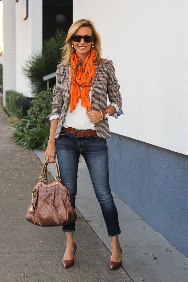 Brown, orange, and white blazer with orange scarf and jeans for fancy casual  fall outfit.