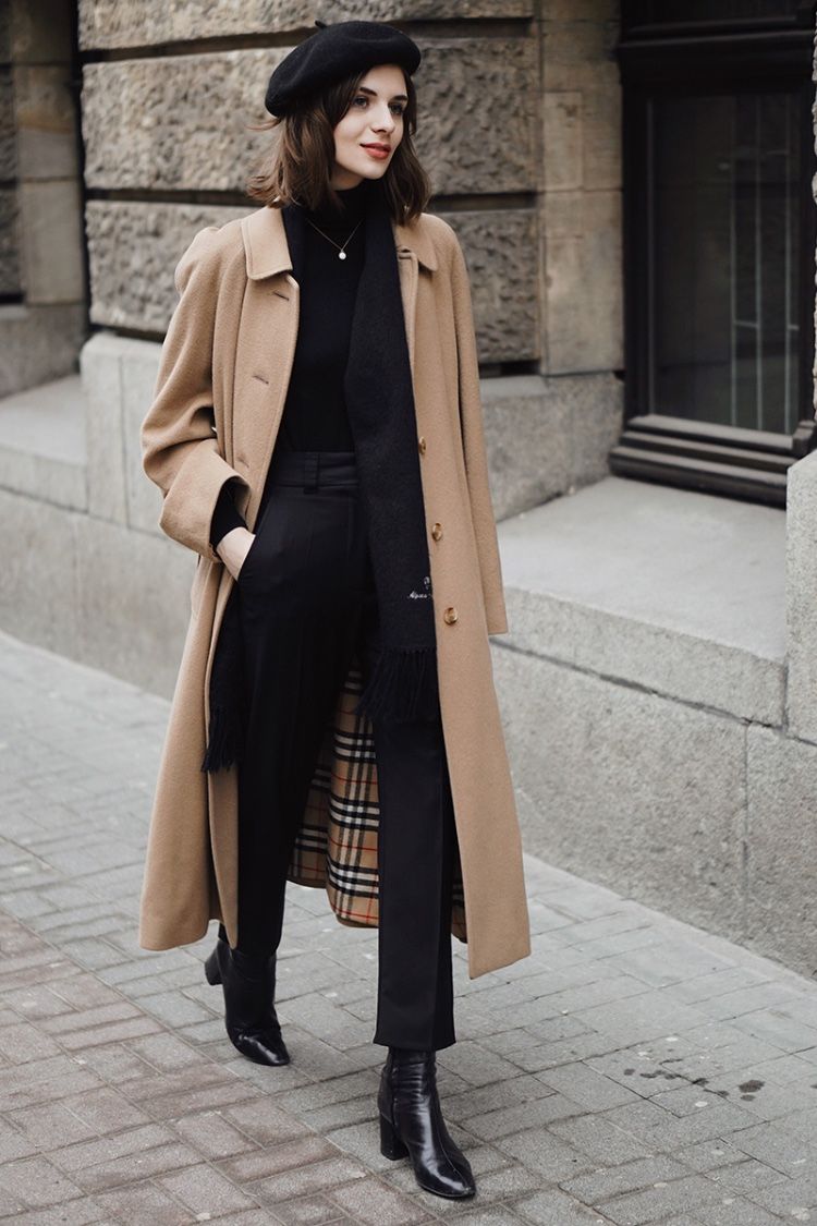 Beige Burberry trench coat with a black beret