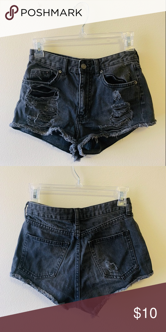 Distressed Black Shorts Black denim shorts with distressing detailing on both fr…