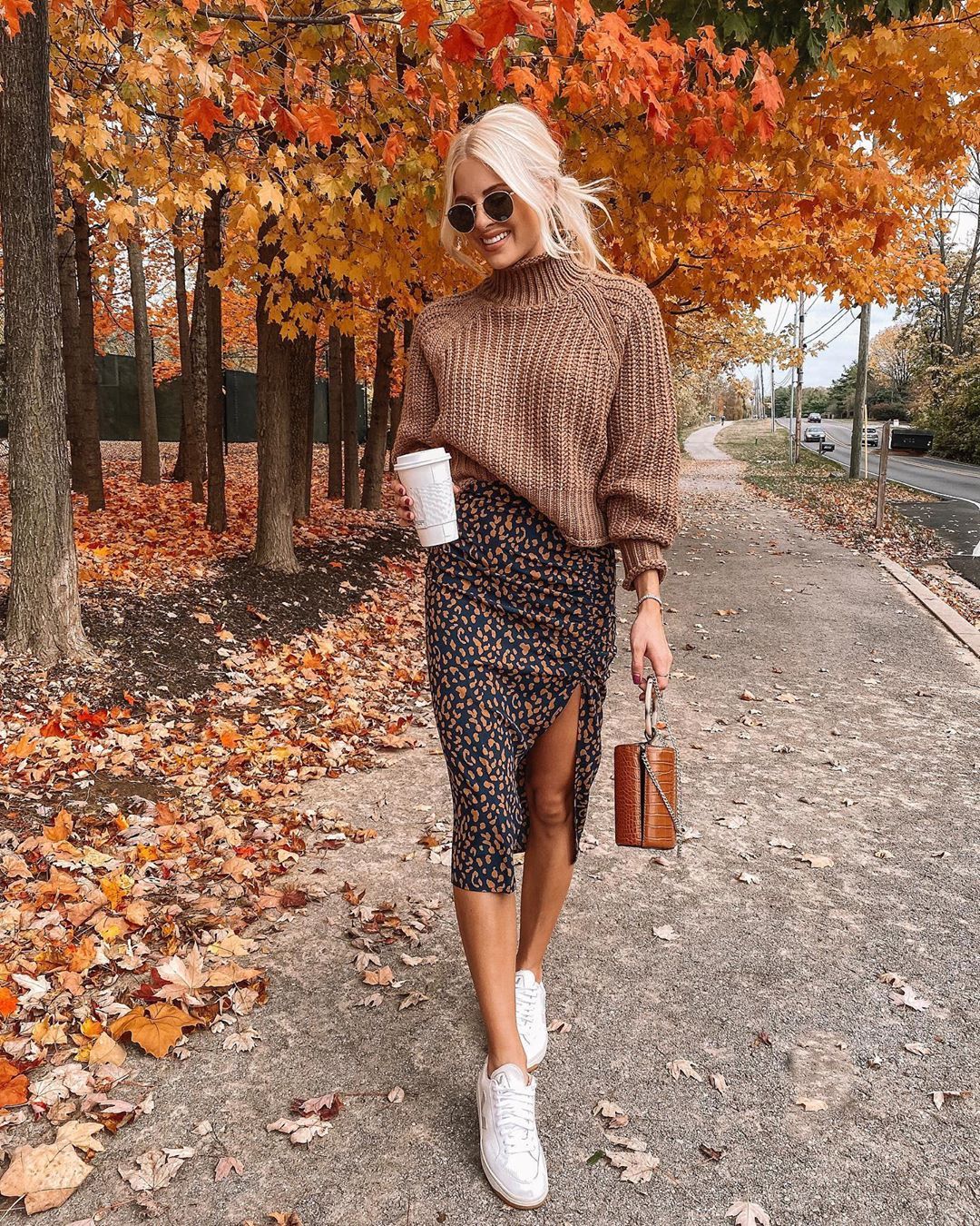 Kathleen Post on Instagram: “Wishing these leaves would stay forever 🍁🍂 Midi skirt & sneaks is still one of my fave combos 👉🏼 linked on the LTK app and via the link in…”
