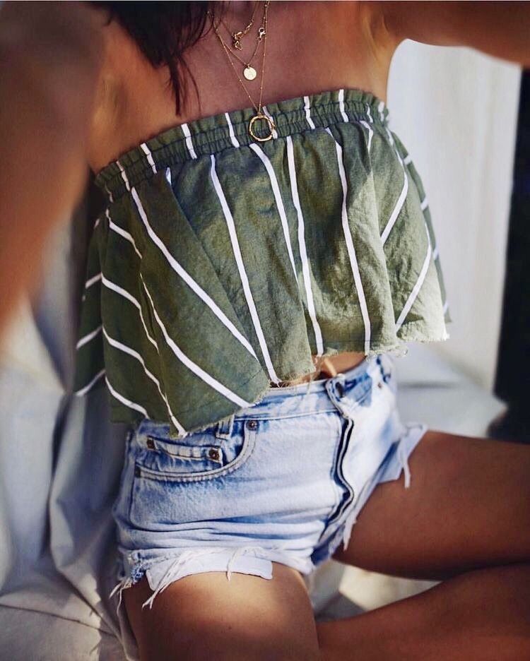 Simple summer outfit—Green striped flowy tube top with jean shorts.